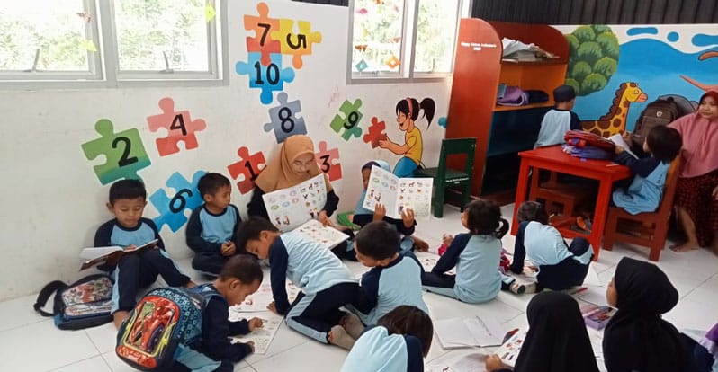 Storytime and book activity in the classroom at one of my schools